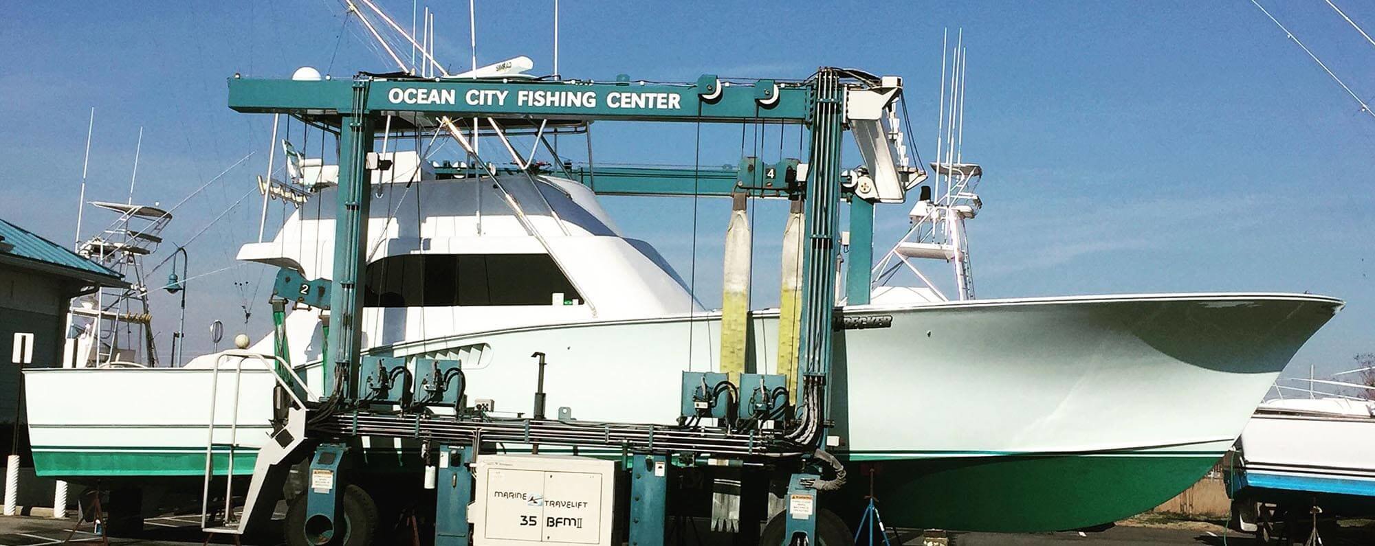 Ocean City Fishing Center travel lift carrying a boat Ocean City Fishing Center travel lift carrying a boat
